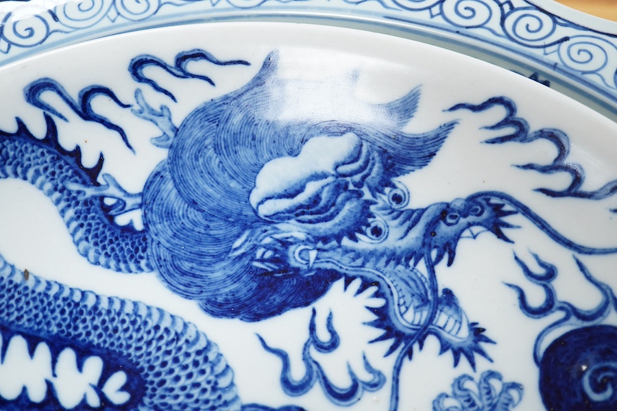 Two large Chinese blue and white chargers, largest 62cm diameter. Condition - good